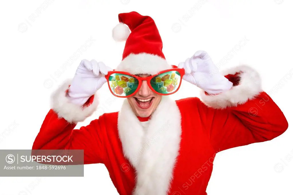 Smiling man dressed as Santa Claus wearing oversized novelty glasses