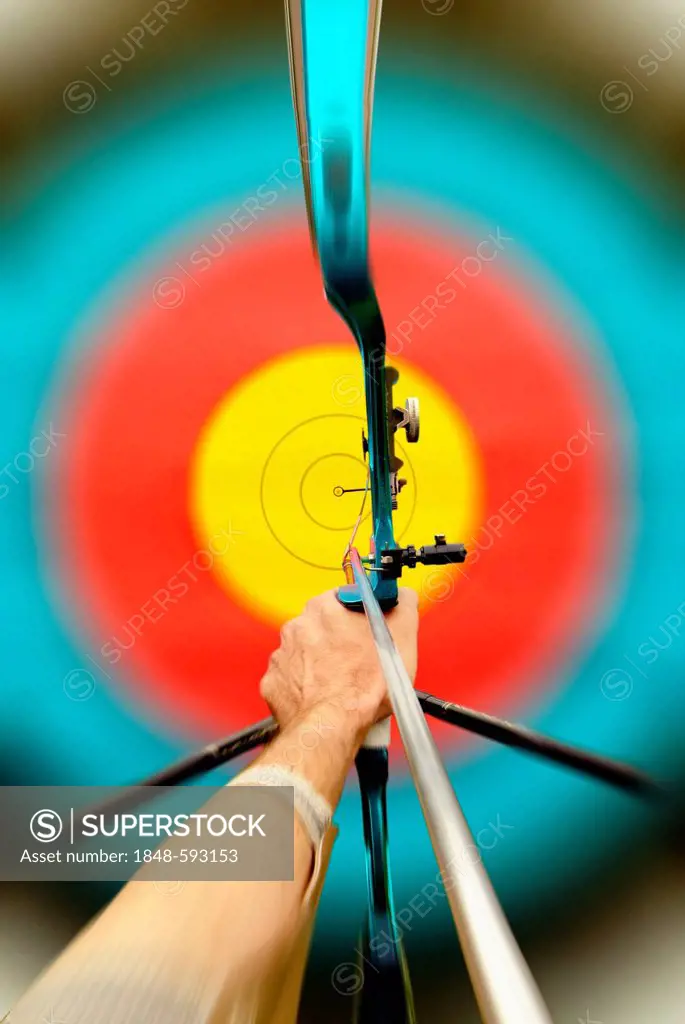 Archery, archer aiming towards a target