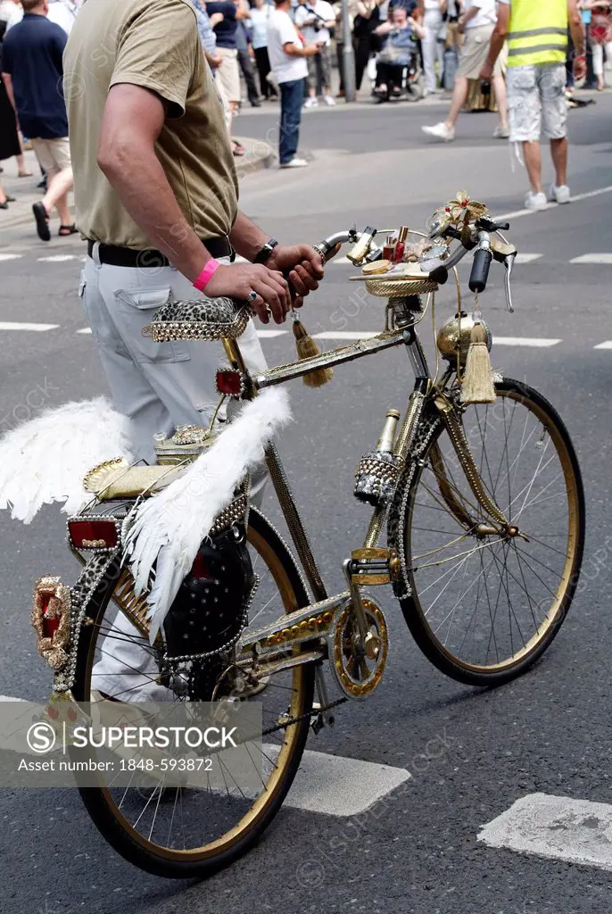 Golden bicycle decorated with Pegasus wings, Christopher Street Day in Duesseldorf, North Rhine-Westphalia, Germany, Europe