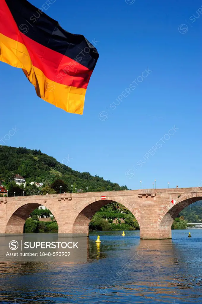 German flag in front of the Alte Bruecke or Karl-Theodor-Bruecke bridge, Heidelberg, Neckar valley, Baden-Wuerttemberg, Germany, Europe