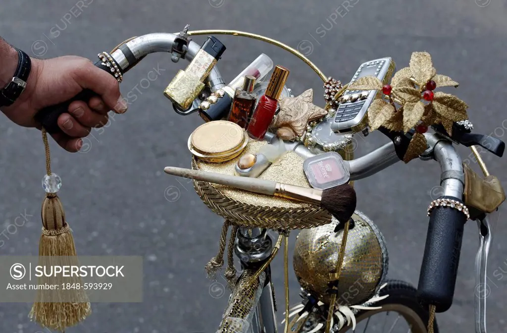 Handlebars of a ladies bicycle decorated with makeup and cell phone, Christopher Street Day in Duesseldorf, North Rhine-Westphalia, Germany, Europe