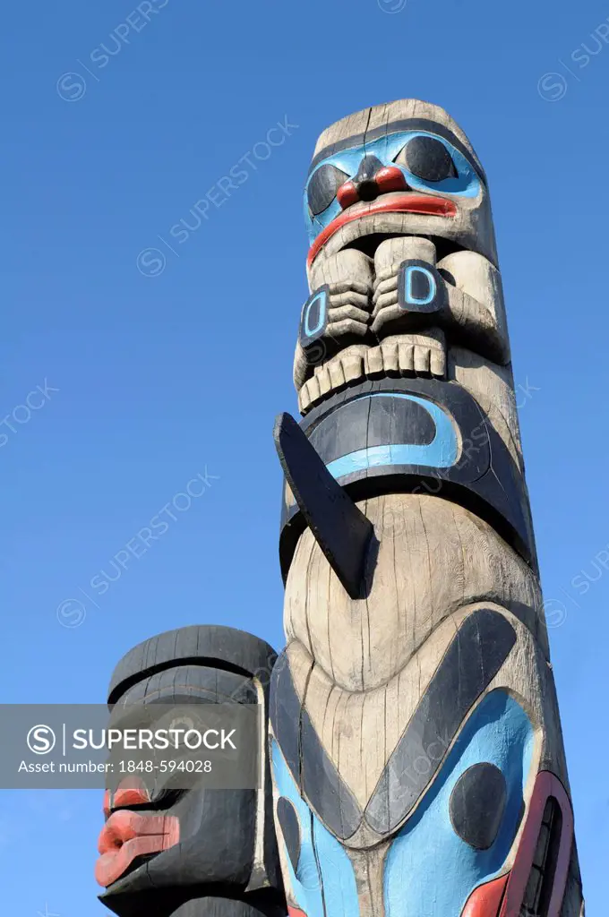 Human Above Killer Whale Above Indian Chief Holding Copper totem by Francis Horne 1986, Duncan, Vancouver Island, British Columbia, Canada