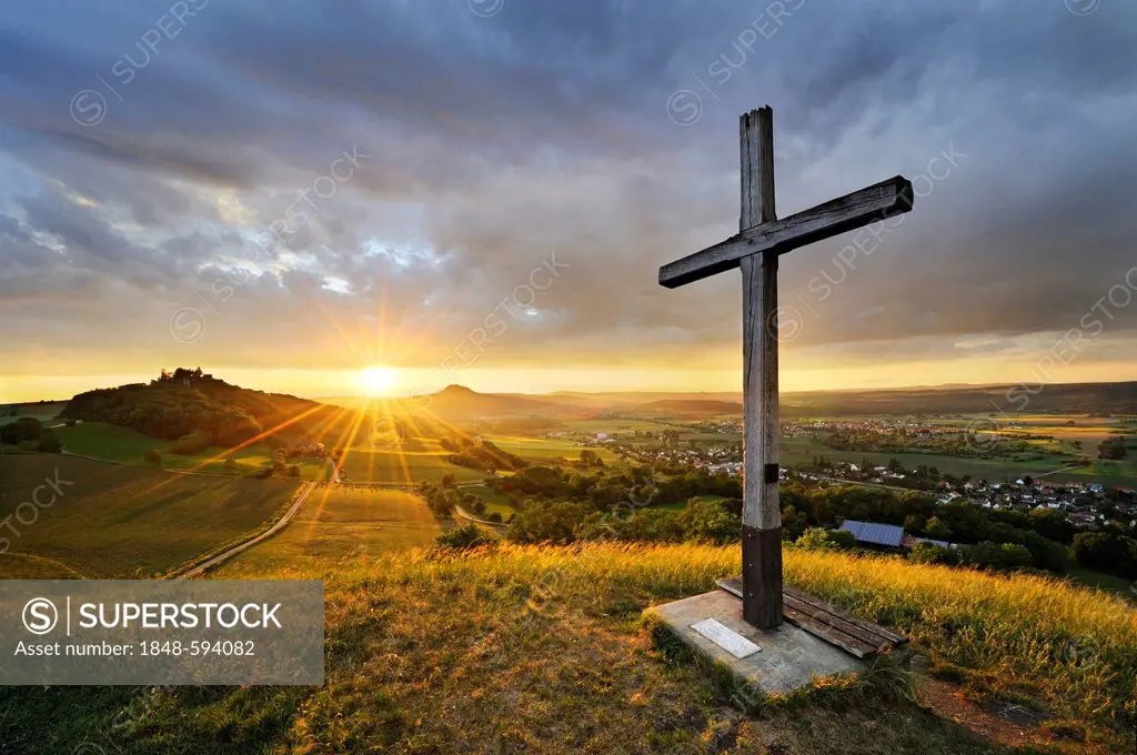 Cross in the Hegau landscape, sunset and Maegdeberg mountain at the back, district of Konstanz, Constance, Baden-Wuerttemberg, Germany, Europe