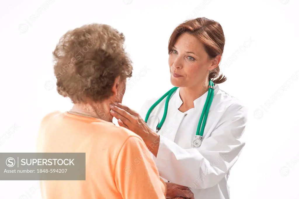 Doctor examining an elderly patient