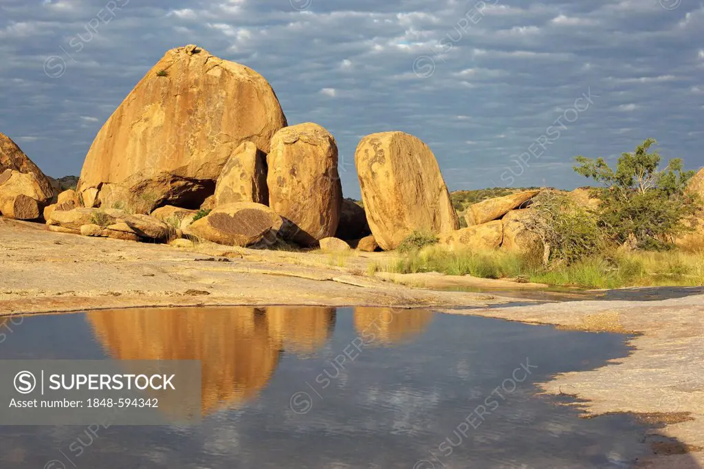 Granite rocks Bull's Party with reflection in water, Ameib Ranch, Namibia, Africa