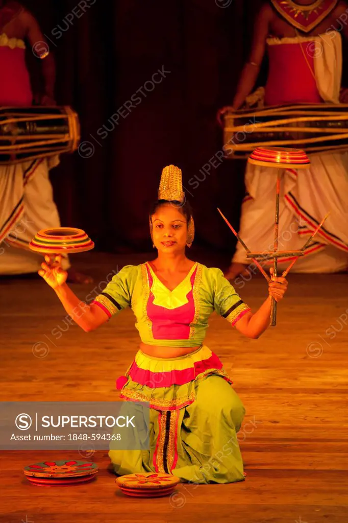 Juggling dancer during a performance of the Kandy Dancers, Kandy, Sri Lanka, Indian Ocean