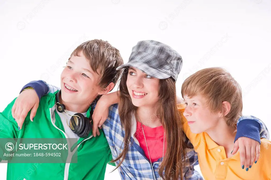 Three friends, one girl and two boys, arm in arm