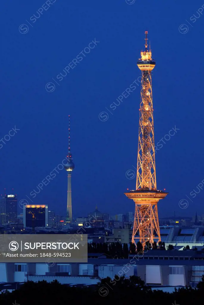 Radio Tower West and TV Tower East, night skyline, view from Mt. Teufelsberg with Alexanderplatz, Park Inn Hotel, Siegessaeule or Victory Column, Berl...