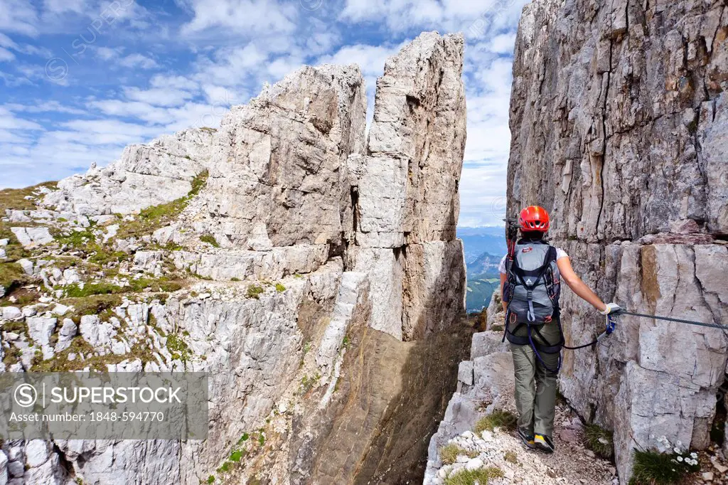 Mountain climber on the Latemar Crossing climbing route, Dolomites, Alto Adige, Italy, Europe