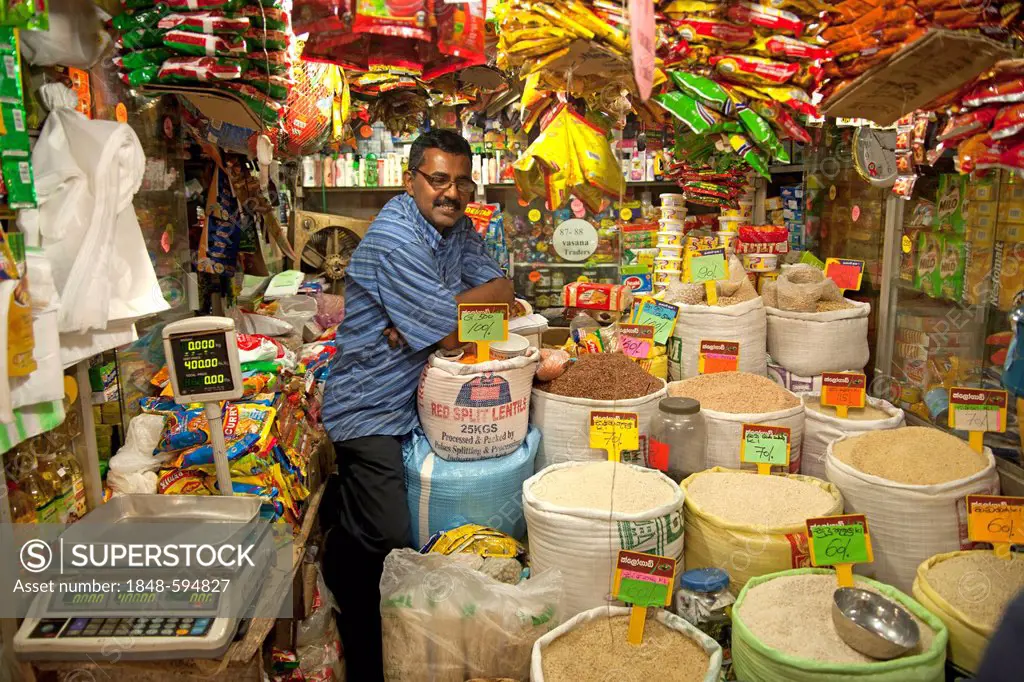 Merchant selling rice and groceries on the market in Kandy, Sri Lanka, Indian Ocean