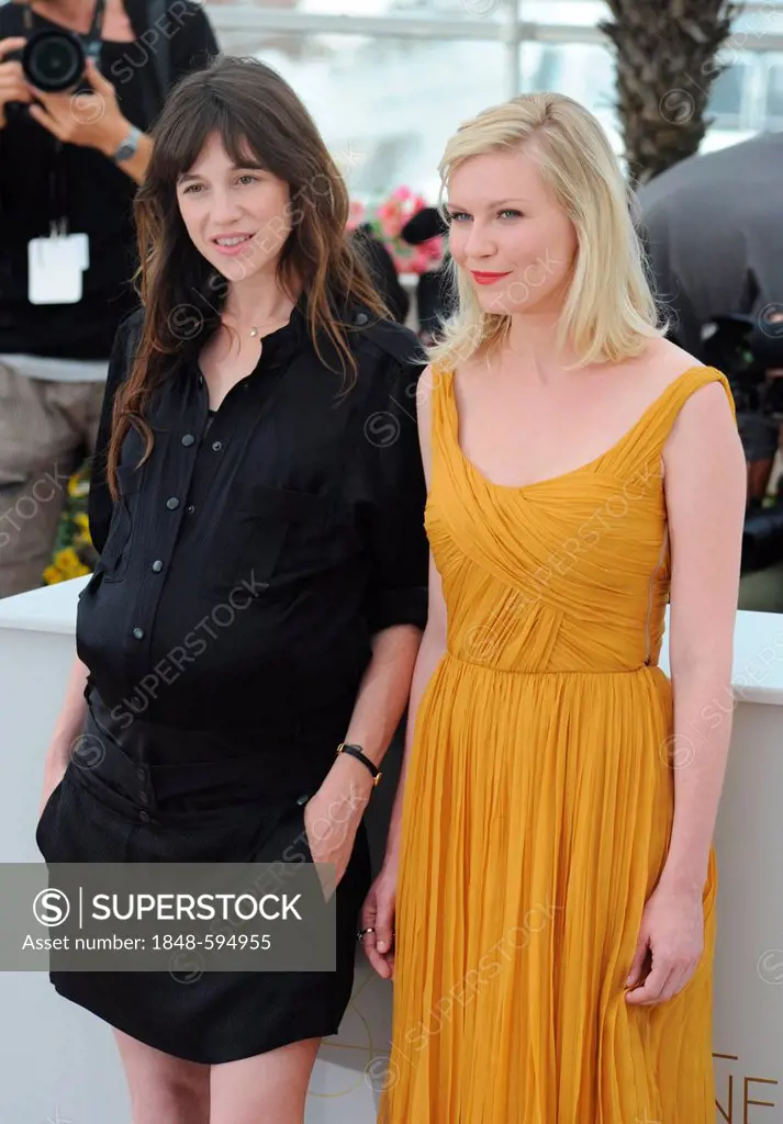The pregnant Charlotte Gainsbourg and Kirsten Dunst during the foto session for Melancholia at Palais des Festivals, 64th International Film Festival ...