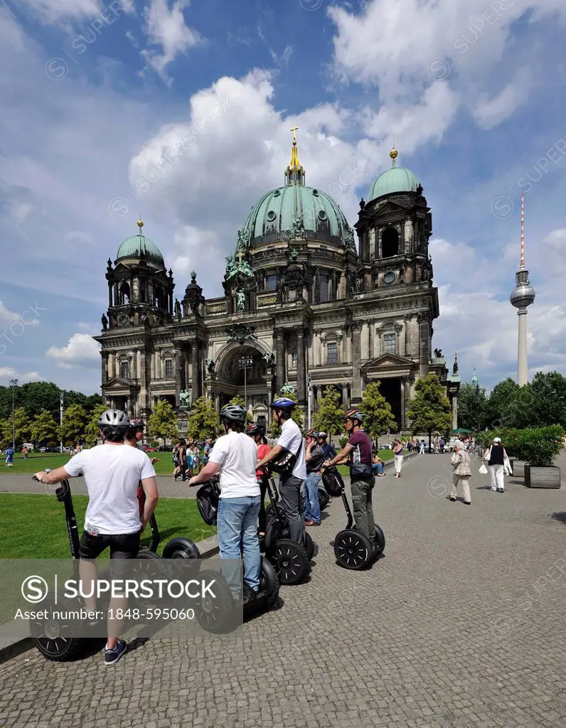 City tour for tourists riding Segways, in front of Berlin Cathedral, Supreme Parish and Collegiate Church in Berlin, Lustgarten pleasure garden, TV To...