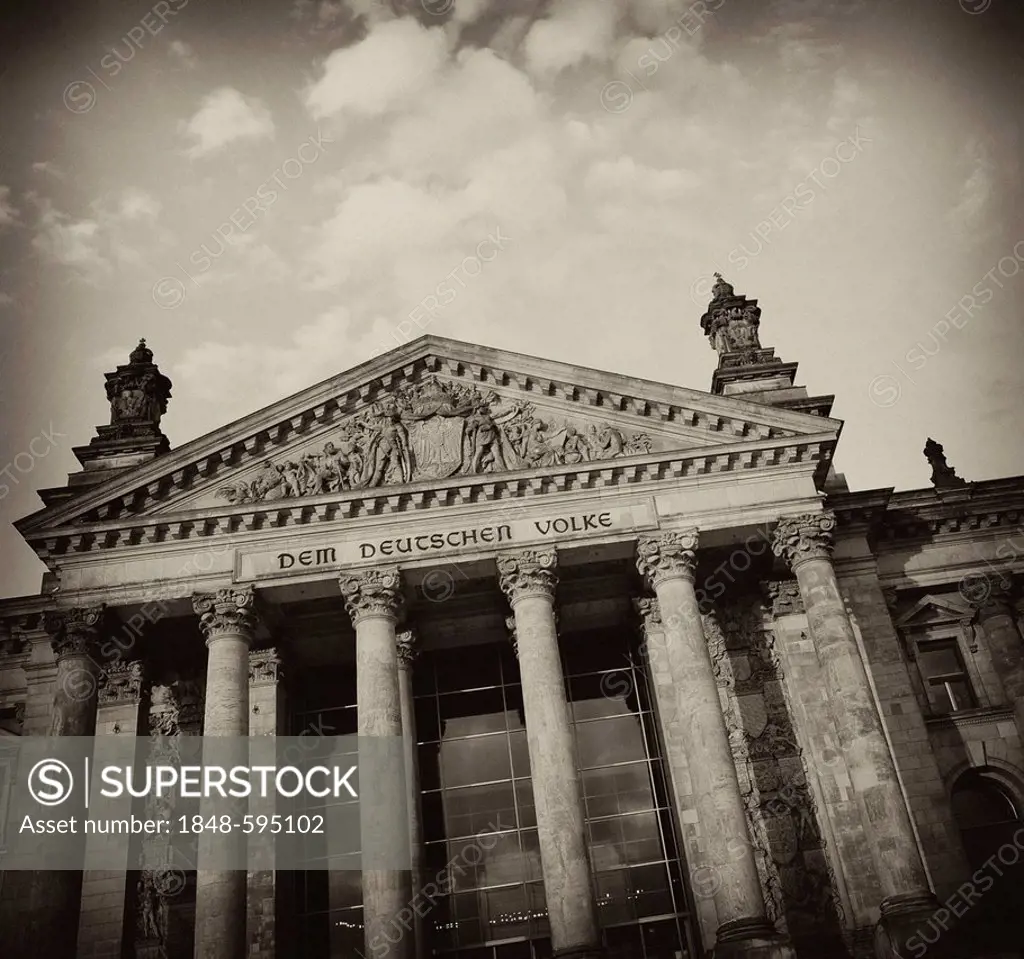 Black and white image, sepia-toned, Reichstag Building, German Parliament, with the inscription, Dem Deutschen Volke, German for To the German People,...