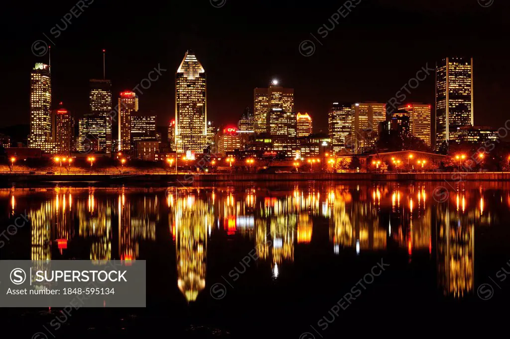 Skyline of Montreal reflected in the St. Lawrence River, Montreal, Quebec, Canada