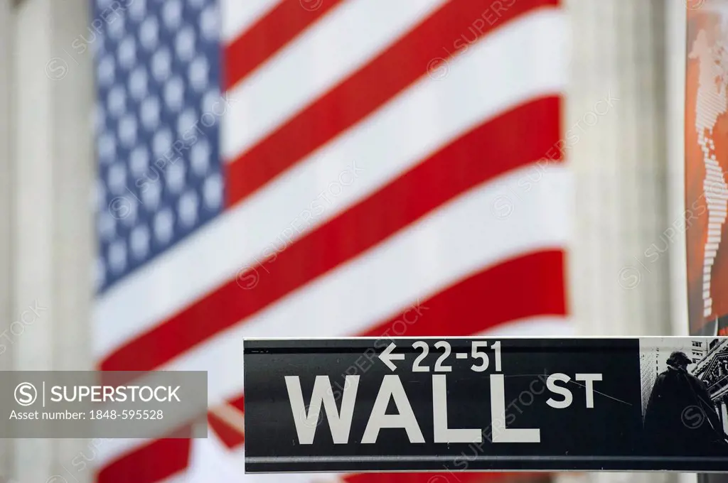 Wall Street street sign in front of a U.S. flag, Manhattan, New York, USA, America