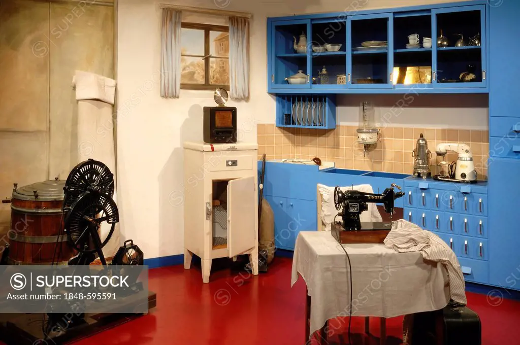 Kitchen from around 1930, on the left an electric washing machine, an electric sewing machine on the right, Museum for Industrial Culture, Aeussere Su...