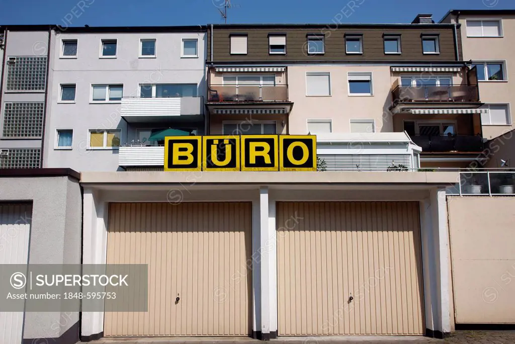 Garages for cars, above a sign saying Buero, German for office, Gelsenkirchen, North Rhine-Westphalia, Germany, Europe