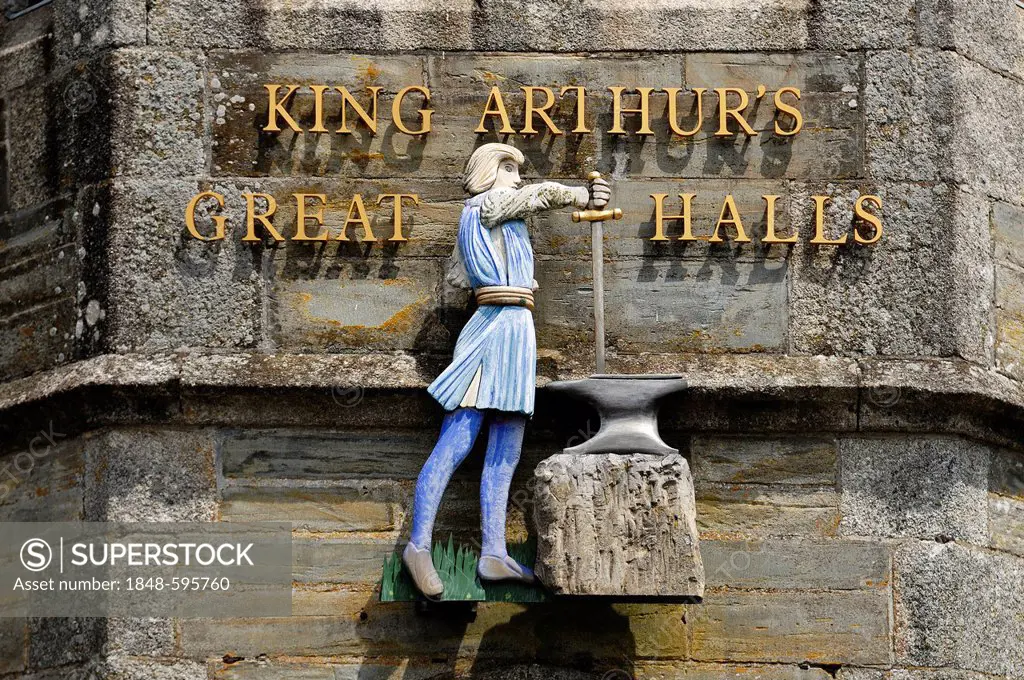 Figure above the entrance to King Arthur's Great Halls, a museum of the history of King Arthur, Fore Street, Tintagel, Cornwall, England, United Kingd...
