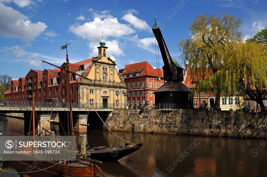 Old crane, 1797, at the harbour of the Ilmenau river, the old department store Kaufhaus with its preserved Baroque facade, the replica of an old barge...