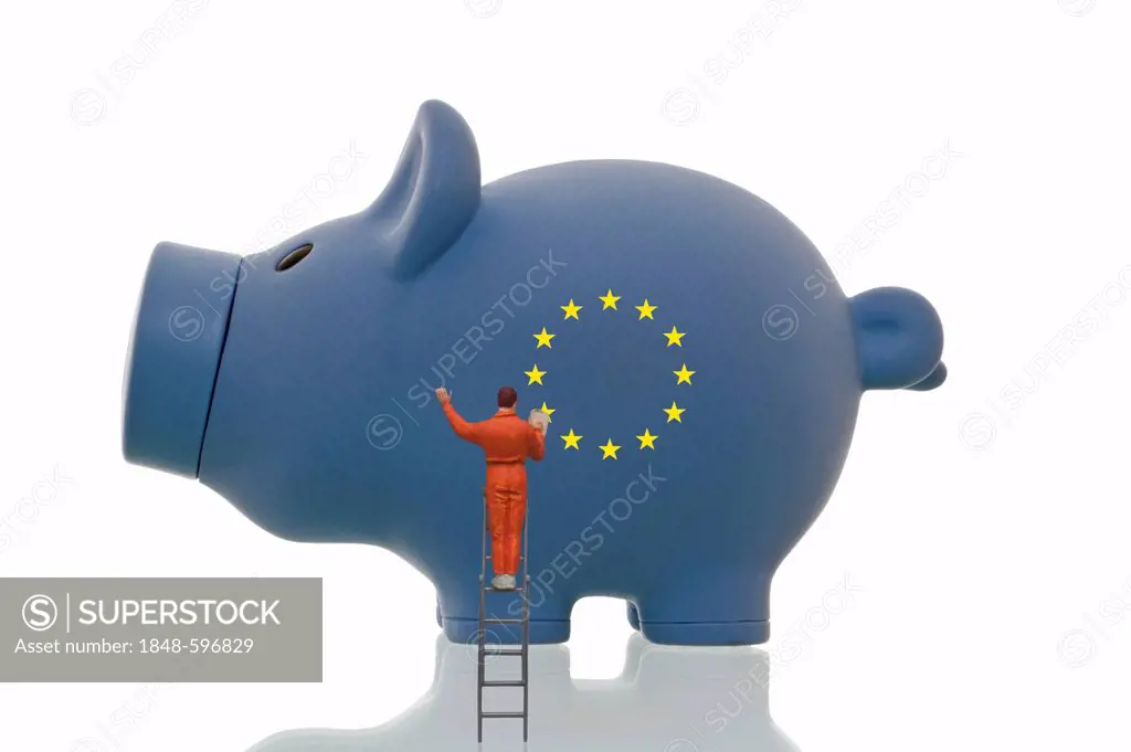 Miniature figurine painting over European stars on a blue piggy bank, symbolic image