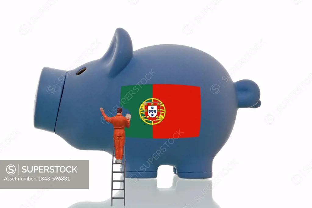 Miniature figurine painting over a Portuguese national flag on a blue piggy bank, symbolic image