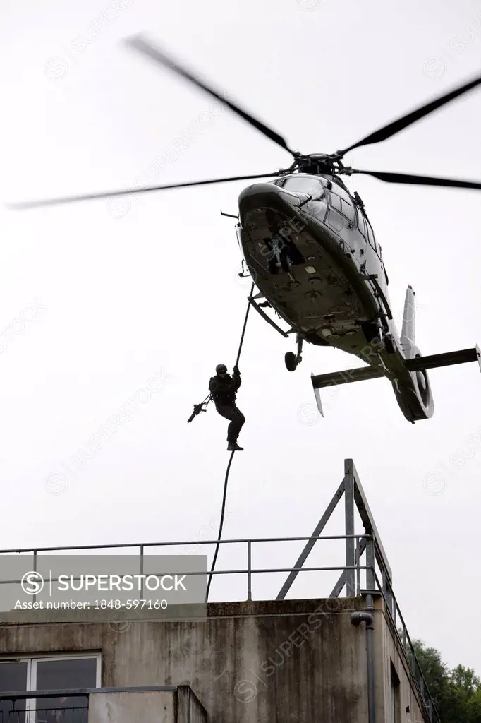 Hostage situation exercise, a special response unit enters a buildig by rappelling or fast roping from a helicopter, training center for special respo...