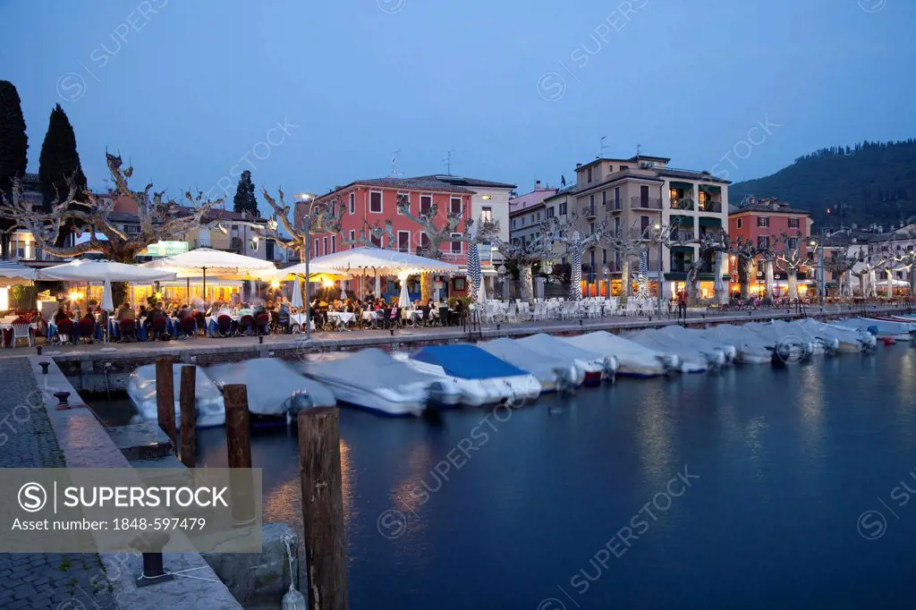 View over the port towards the town at dusk, Garda, Lake Garda, Veneto, Italy, Europe, PublicGround