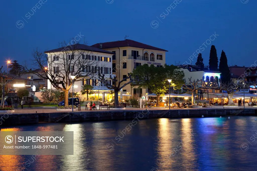 View towards the town with the waterfront promenade at night, Garda, Lake Garda, Veneto, Italy, Europe, PublicGround