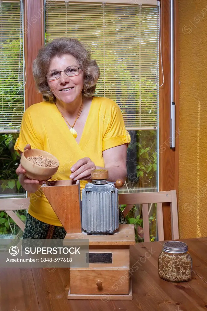Nutritionist with a grain mill