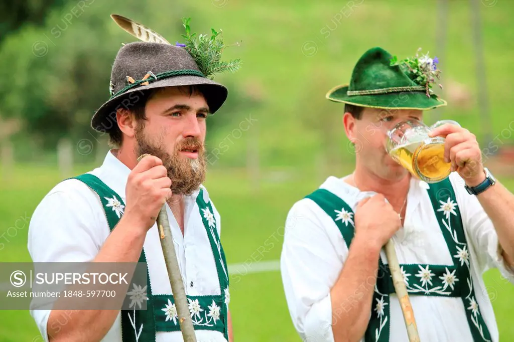 Men wearing traditional costume during Viehscheid, separating the cattle after their return from the Alps, Thalkirchdorf, Oberstaufen, Bavaria, German...
