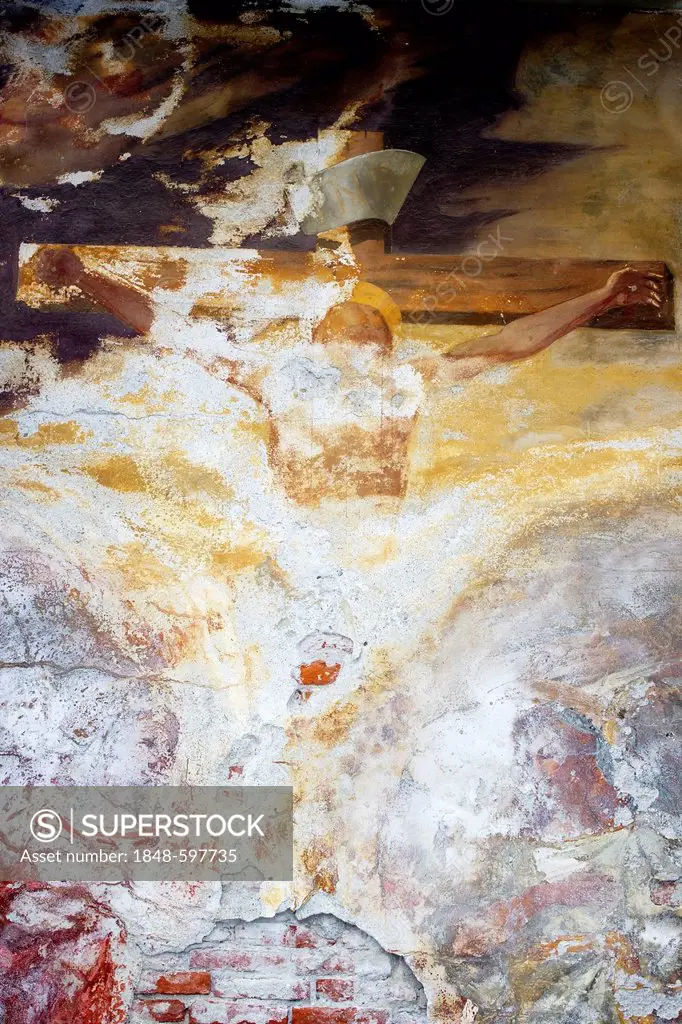 Weathered fresco of the crucifixion in the old cemetery in Brissago, Lago Maggiore, Ticino, Switzerland, Europe