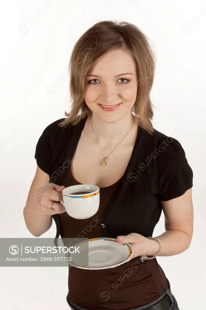 Young woman holding a coffee cup in her hand