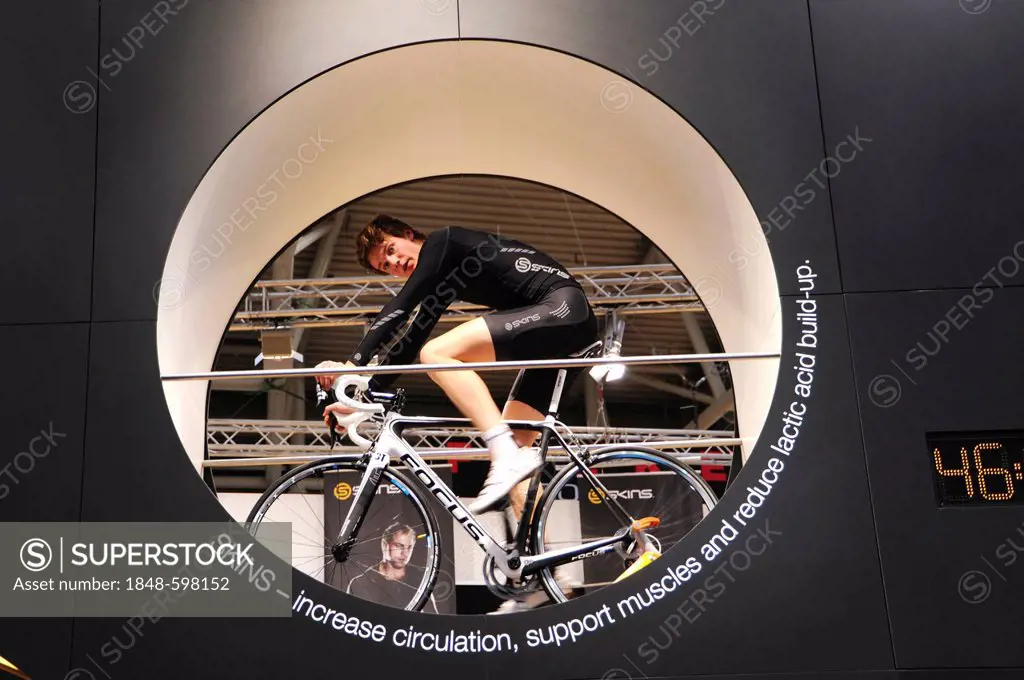 Cyclist at the exhibition booth of Skins, ISPO, International Sports Business Network, a trade fair for sports equipment and fashion, Munich, Bavaria,...