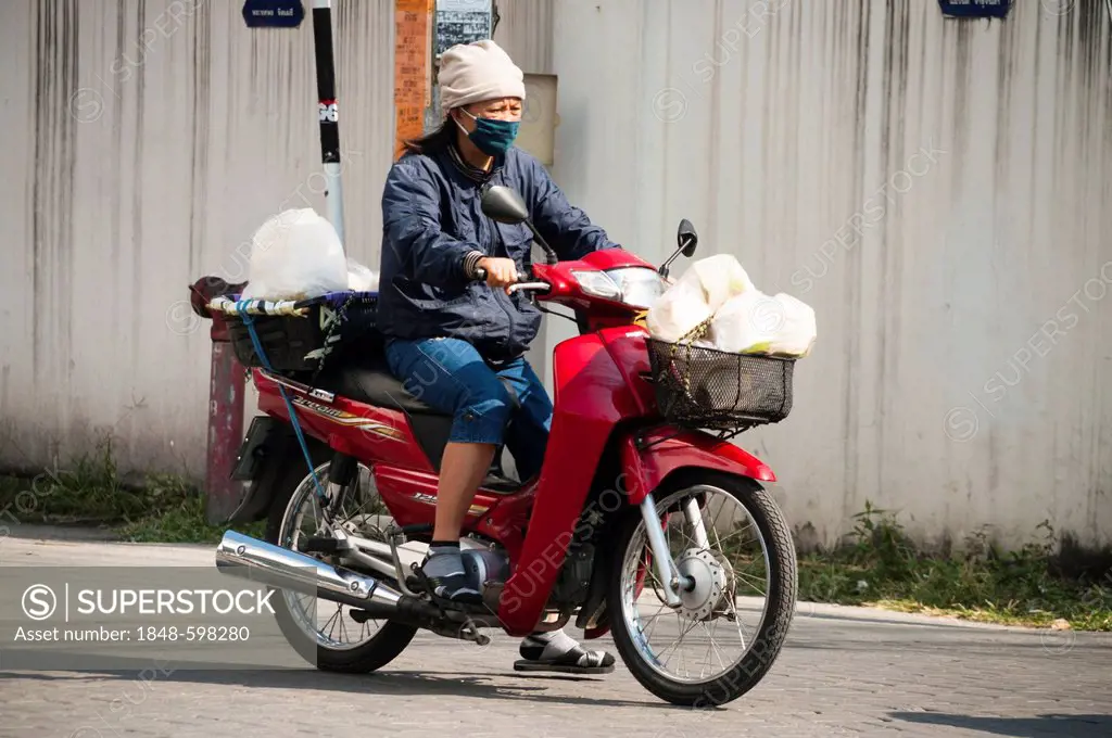 Woman on a motorcycle, Chiang Mai, Northern Thailand, Thailand, Asia