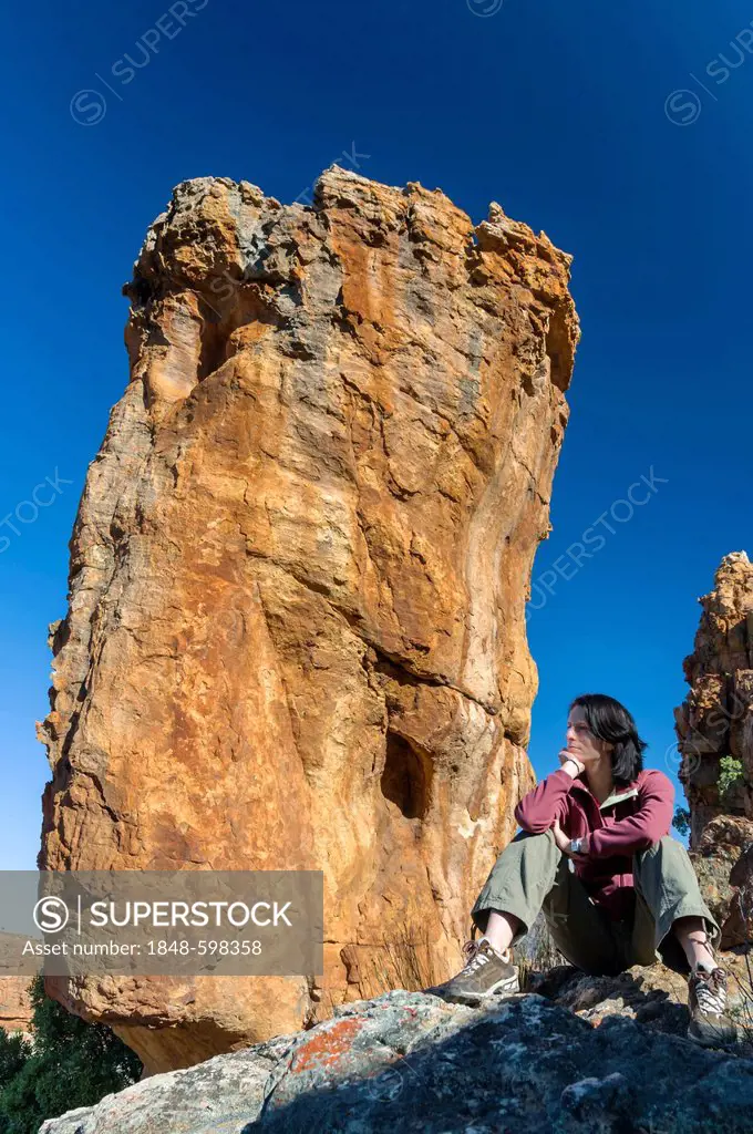 Woman relaxing on a rock, rock formations, Cederberg mountains, Western Cape, South Africa, Africa