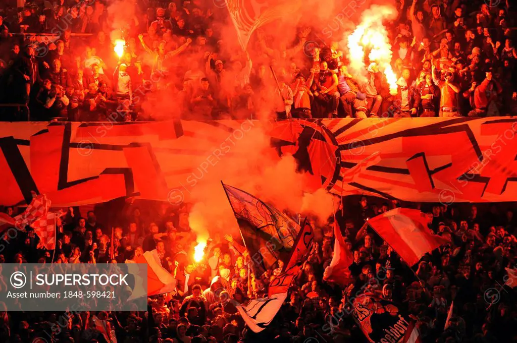 Flares are lit in the Fortuna Duesseldorf fan section during the second leg relegation match between Fortuna Duesseldorf and Hertha BSC Berlin, 15/05/...
