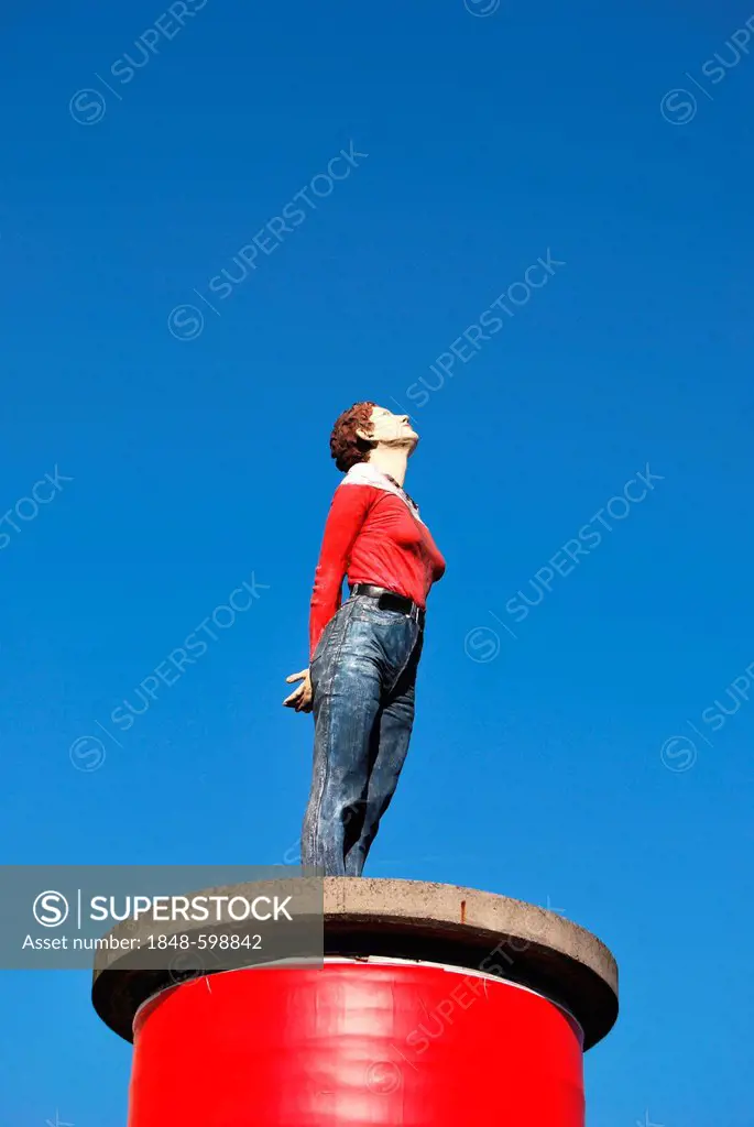 Woman looking up, sculpture on a red pillar pedestal, Duesseldorf, North Rhine-Westphalia, Germany, Europe