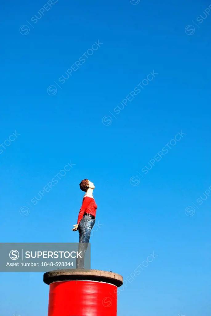 Woman looking up, sculpture on a red pillar pedestal, Duesseldorf, North Rhine-Westphalia, Germany, Europe