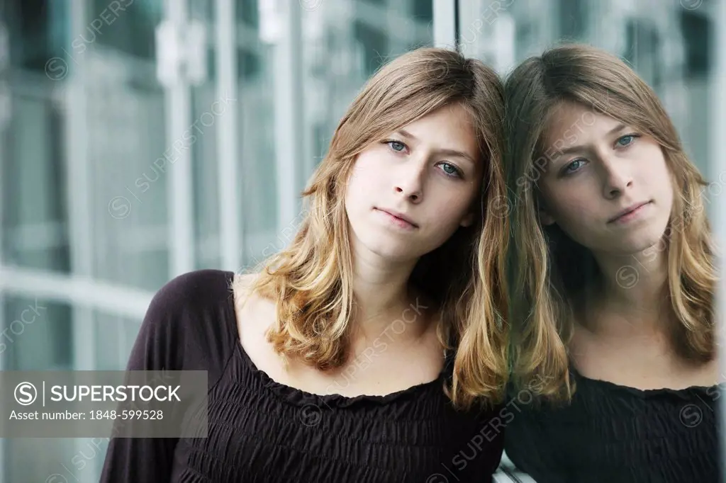 Young woman, portrait, reflection in glass