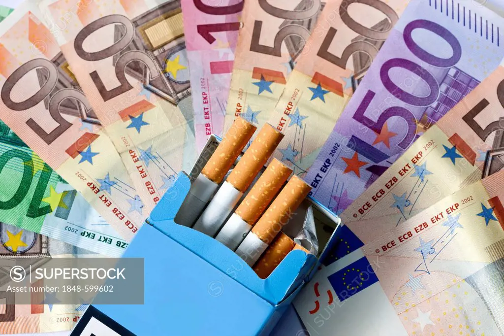 Smoking costs money, euro bank notes and cigarettes