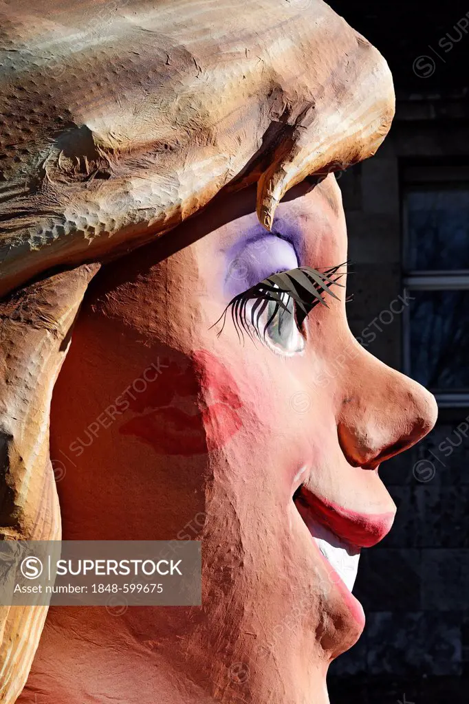 Radiant face of a blond woman with a lipstick imprint on her cheek, paper-mache figure, parade float at the Rosenmontagszug Carnival Parade 2011, Dues...