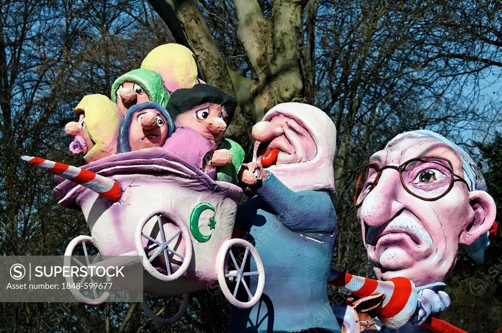 Thilo Sarrazin, impaling Turkish migrants, paper-mache figures, satirical themed parade float at the Rosenmontagszug Carnival Parade 2011, Duesseldorf...