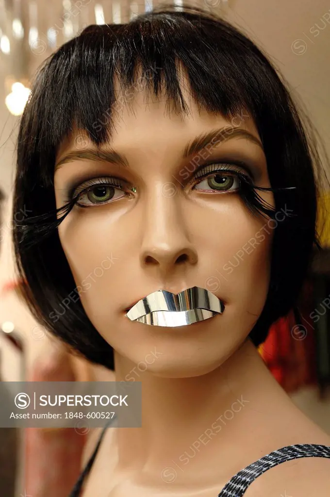 Female mannequin with lips made of silver foil in a fashion store, Nuremberg, Middle Franconia, Bavaria, Germany, Europe