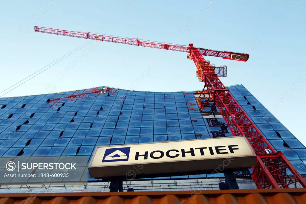 Construction site of the Elbphilharmonie philharmonic hall with crane and name of the construction group Hochtief, Hafencity harbour city, Hamburg, Ge...