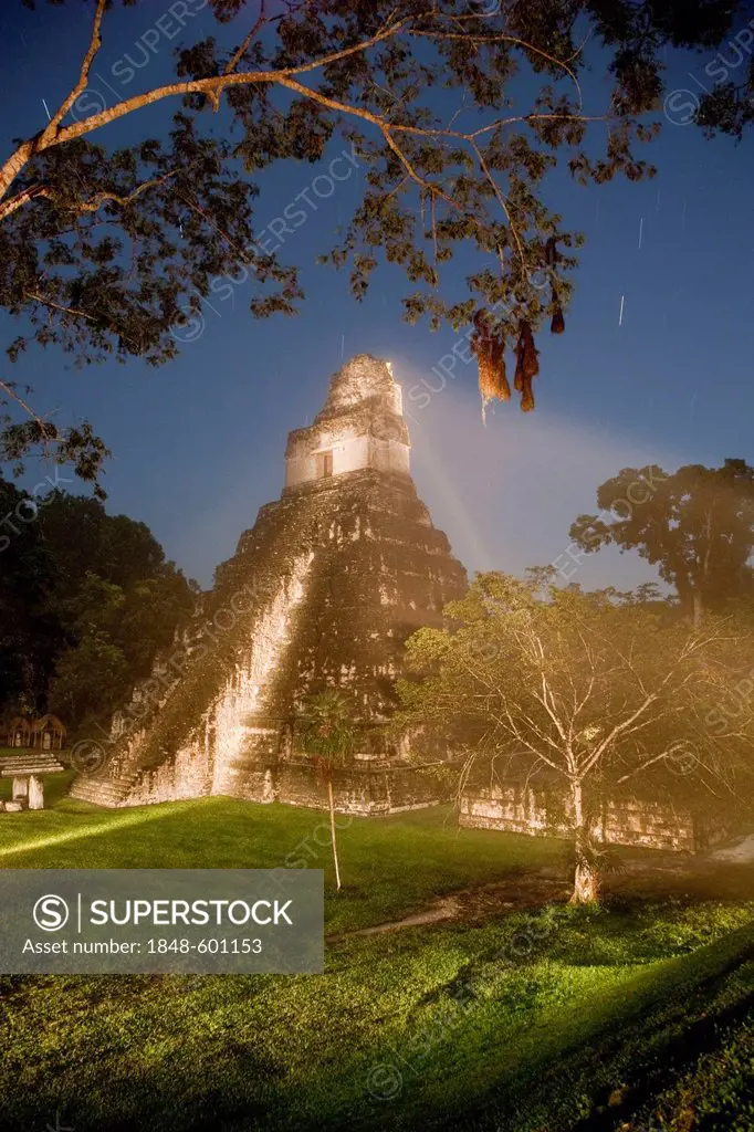 Temple II at the Grand Plaza, illuminated at night, Tikal archeological site, Peten Department, Guatemala, Central America