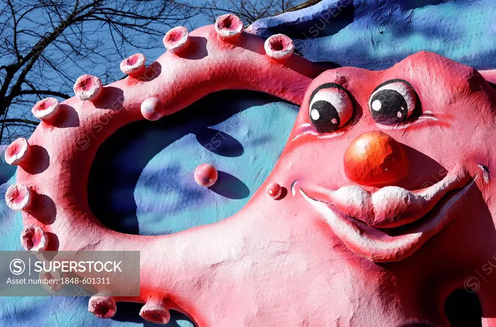 Funny octopus with a human face, waving with its tentacle, cartoon style paper-mache figure, parade float at the Rosenmontagszug Carnival Parade 2011,...