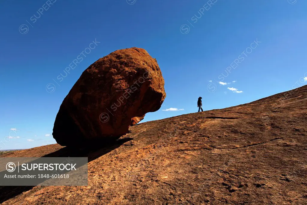 Person next to a large boulder at Beringbooding Rock, Western Australia, Australia
