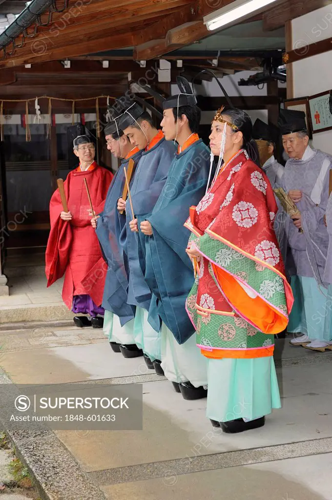 Priests and Miko, a female shaman, lining up before a ceremony, Imamiya Shrine, Autumn Festival of Jidai-Matsuri, Kyoto, Japan, Asia