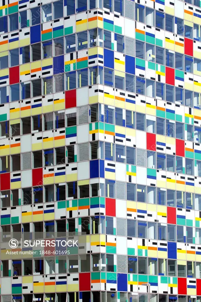 Colorful glass facade of the modern Colorium tower, Medienhafen port in Duesseldorf, North Rhine-Westphalia, Germany, Europe