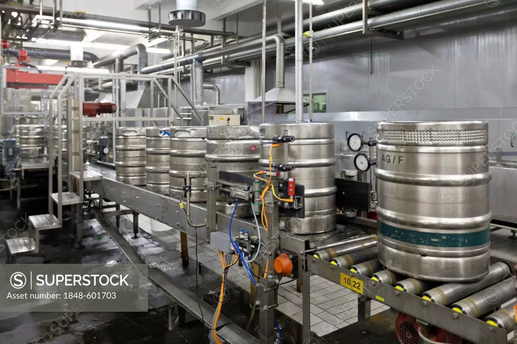 Beer kegs being filled on a conveyor belt, Binding brewery, Frankfurt, Hesse, Germany, Europe